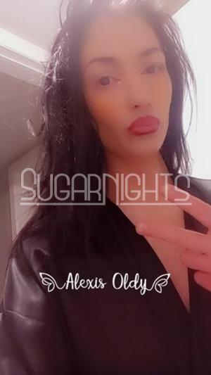 Alexis, Denver escort, brunette, brown eyes, red lipstick, and a black top Alexis, Denver escort, brunette, brown eyes, red lipstick, and a black top